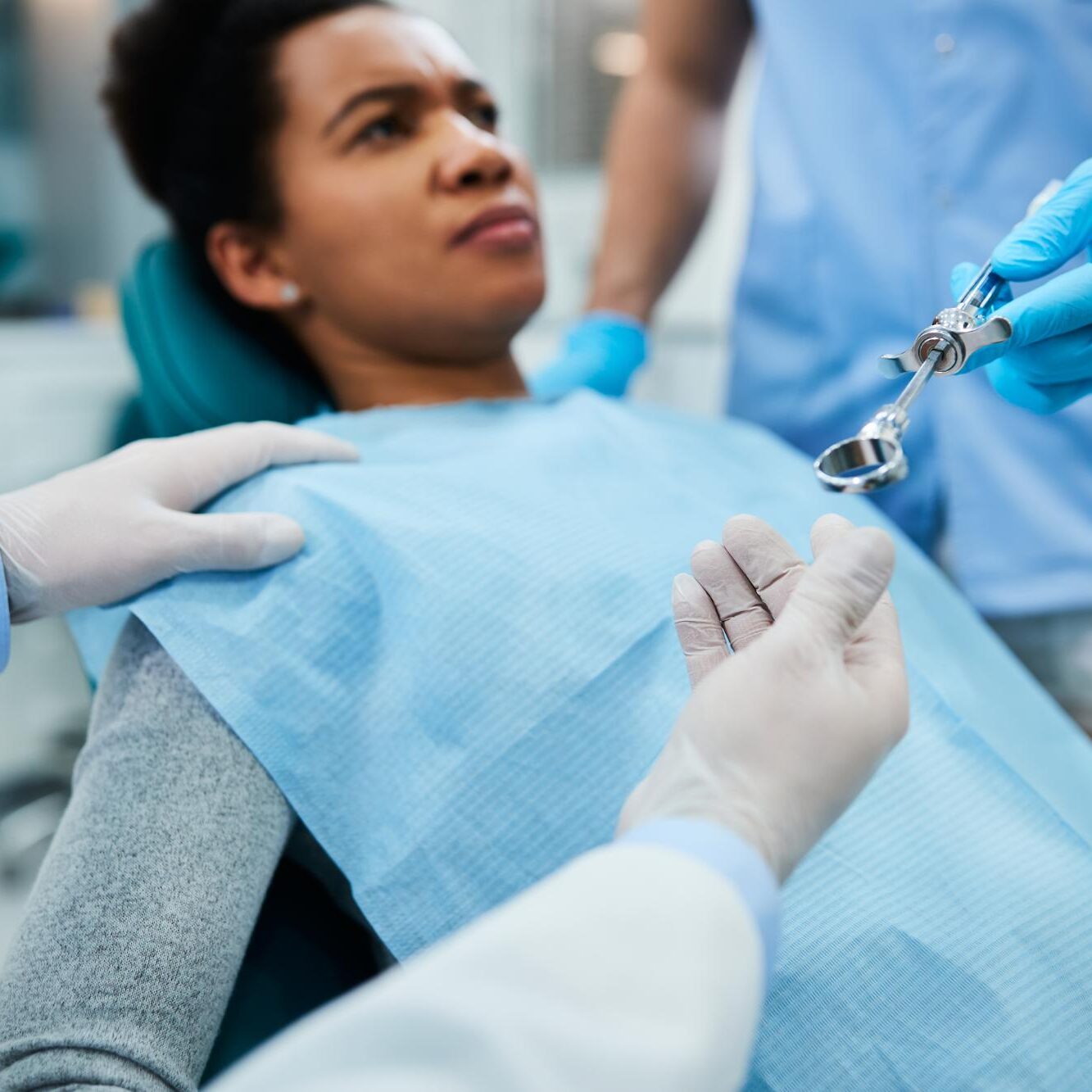 close-up-of-dental-assistant-passing-syringe-to-a-2023-11-27-05-05-00-utc (1) Tooth Extractions